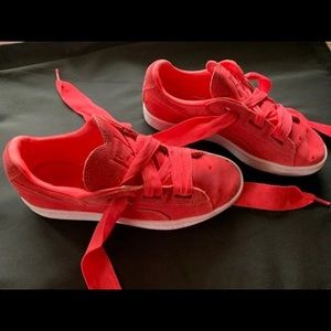 Red heart suede pumas